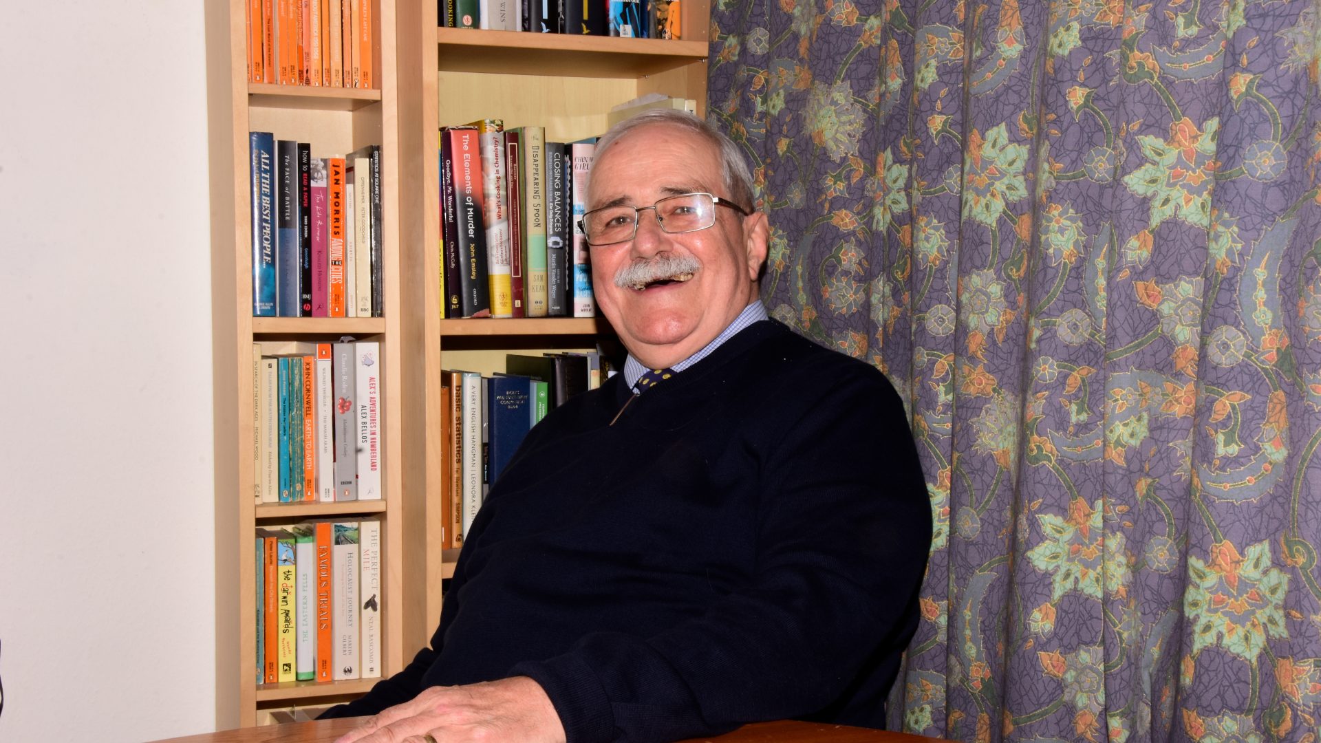 Bob Dunkley, retired pharmacist, smiling at the camera
